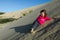 Little girl rolled down Te Paki Sand Dunes