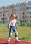 Little girl rollerblading rides in  stadium