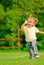 Little girl runs across field