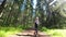 Little girl runs along a forest path in summer. Slow motion