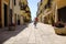 A little girl runs happily in the picturesque Italian village. San Felice Circeo, Lazio, Italy