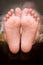 A little girl\'s bare feet