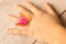 Little girl`s hand with a funny ring on her finger