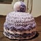 Little Girl\'s Purple And Pink Crocheted Pom Pom Cap.