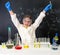 Little girl-scientist happy with a chemnical experiment