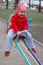 Little girl on seesaw (teeter-totter).