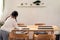 Little girl setting up dining table