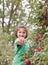 Little Girl Showing An Apple