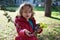 Little girl shows acorns in hand