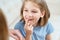 Little girl shows mother reeling tooth. changing milk teeth to indigenous teeth.