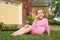 Little girl sits and finishes eating ice cream