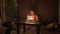 Little girl sits in front of a cake with candles.