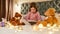 A little girl is sitting alone cross-legged barefoot on a huge bed reading a book enjoying her time with teddybears and