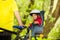 Little girl sitting in bike seat during cycling