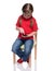 Little girl sitting on a chair and using smartphone