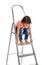 Little girl sitting on ladder on white background.  at home