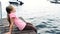 Little girl sitting on private pier