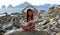 Little girl sitting at rocks at ocean front in Los Cabos Mexico resort cliff sea