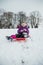 Little Girl Sledding Downhill