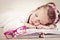 Little girl sleeping on the books