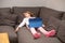 Little girl sleeping watching digital tablet lying on couc