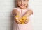 Little girl with slime near white wall