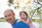 Little girl smiling on her father back