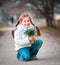 Little girl with a snowdrops