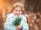 Little girl with a snowdrops