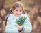 Little girl with a snowdrops