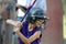 Little girl with softball helmet up to bat