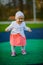 Little girl spending fantastic time on playground. Happy childhood