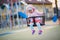 Little girl spending fantastic time on playground. Happy childhood. Authentic image