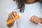 Little girl squeezes the toothpaste on the toothbrush