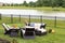 Little girl standing amongst garden furniture