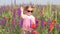 Little girl standing in colorful meadow