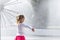 Little girl standing near the dandelion fountain.