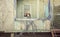 Little girl standing on porch of abandoned cabin