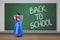 Little girl standing with text of back to school