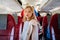 a little girl stands in the aisle of the plane. travel with children