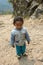 A little girl stands on a mountain road on March 28, 2018 in Nepal.