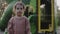 Little girl stands on the playground looking around. Family, child and healthy lifestyle concept.