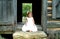 Little Girl on steps of Cabin