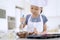 Little girl stirring cookie dough on the bowl