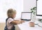 Little girl studying and drawing at desk