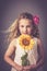 Little girl with a sunflower