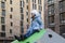 Little girl on sunny spring day Smiling and having good time on kids climbing equipment on playground tightly squeezed residential