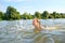 Little girl swim on river