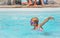 Little girl swimming in a pool