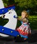 Little girl on a swing in the summer